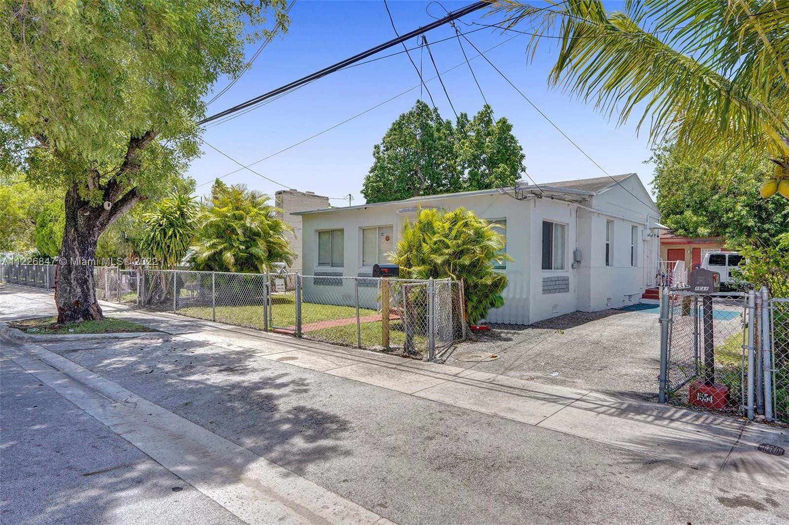 1554 Northwest 58th Street Miami, FL 33142 - Photo 44 of 57 a view of a backyard with a tree