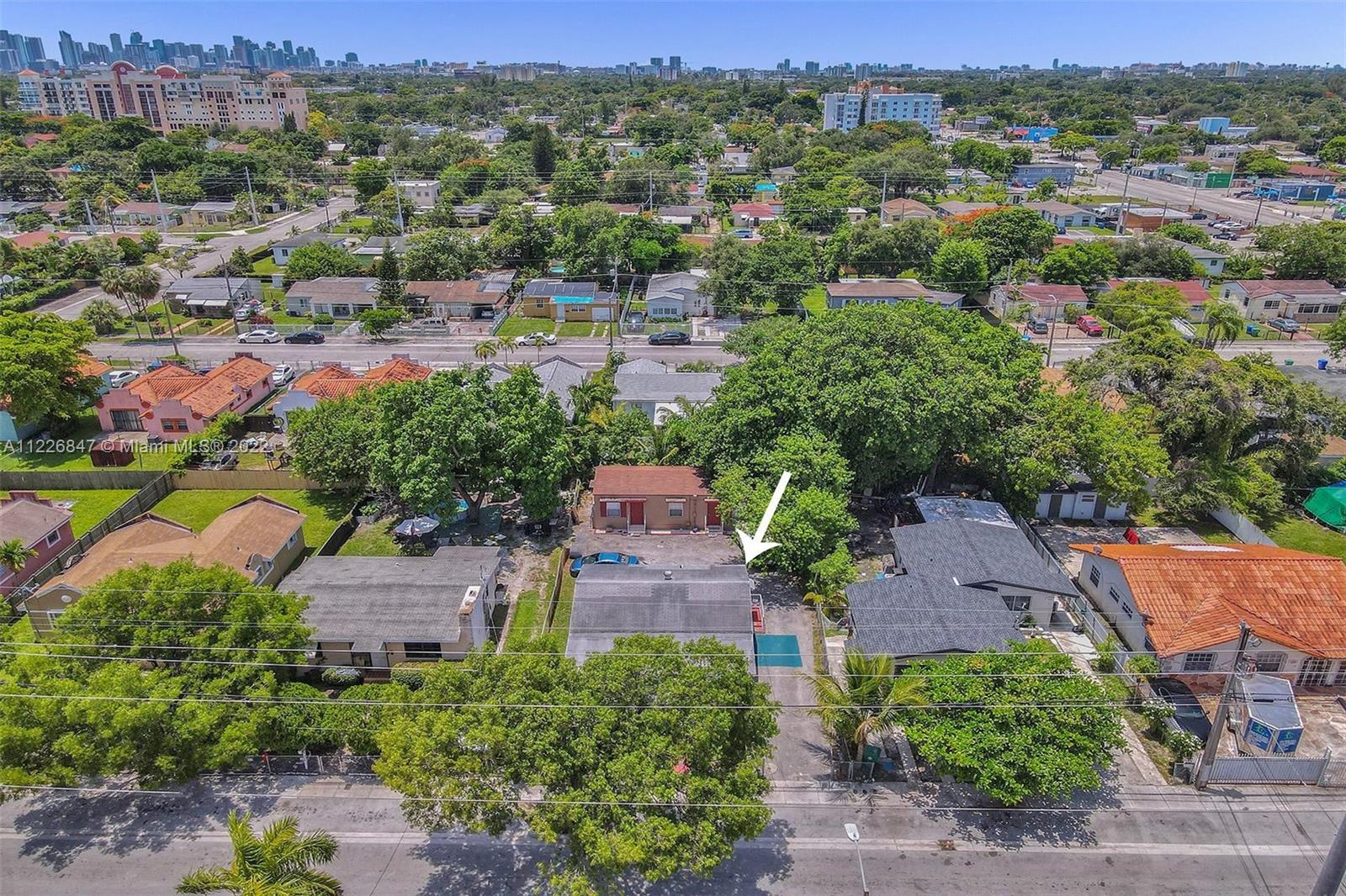 1554 Northwest 58th Street Miami, FL 33142 - Photo 45 of 57 an aerial view of residential houses with outdoor space and street view