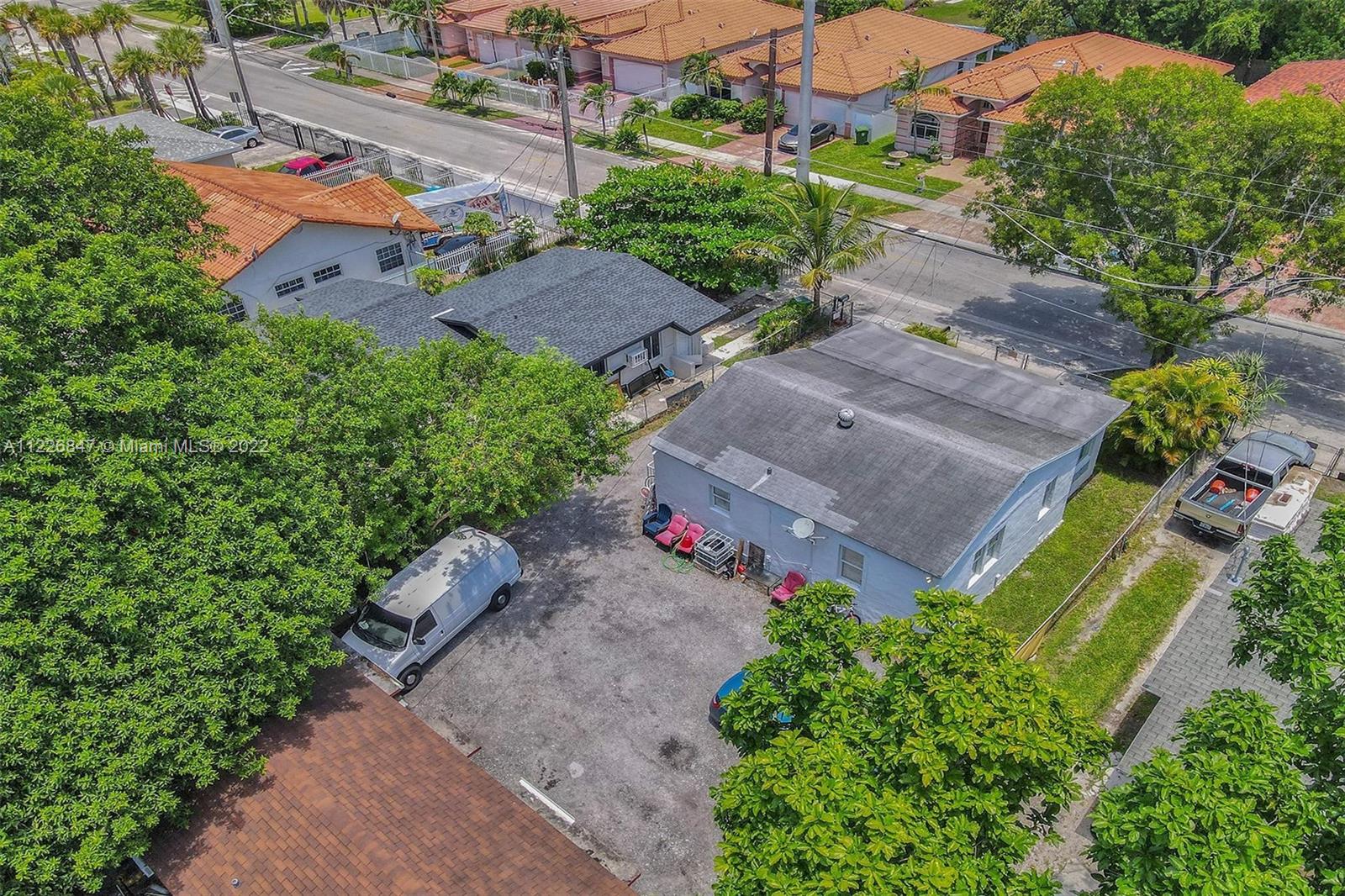 1554 Northwest 58th Street Miami, FL 33142 - Photo 49 of 57 an aerial view of a house with a yard and garden