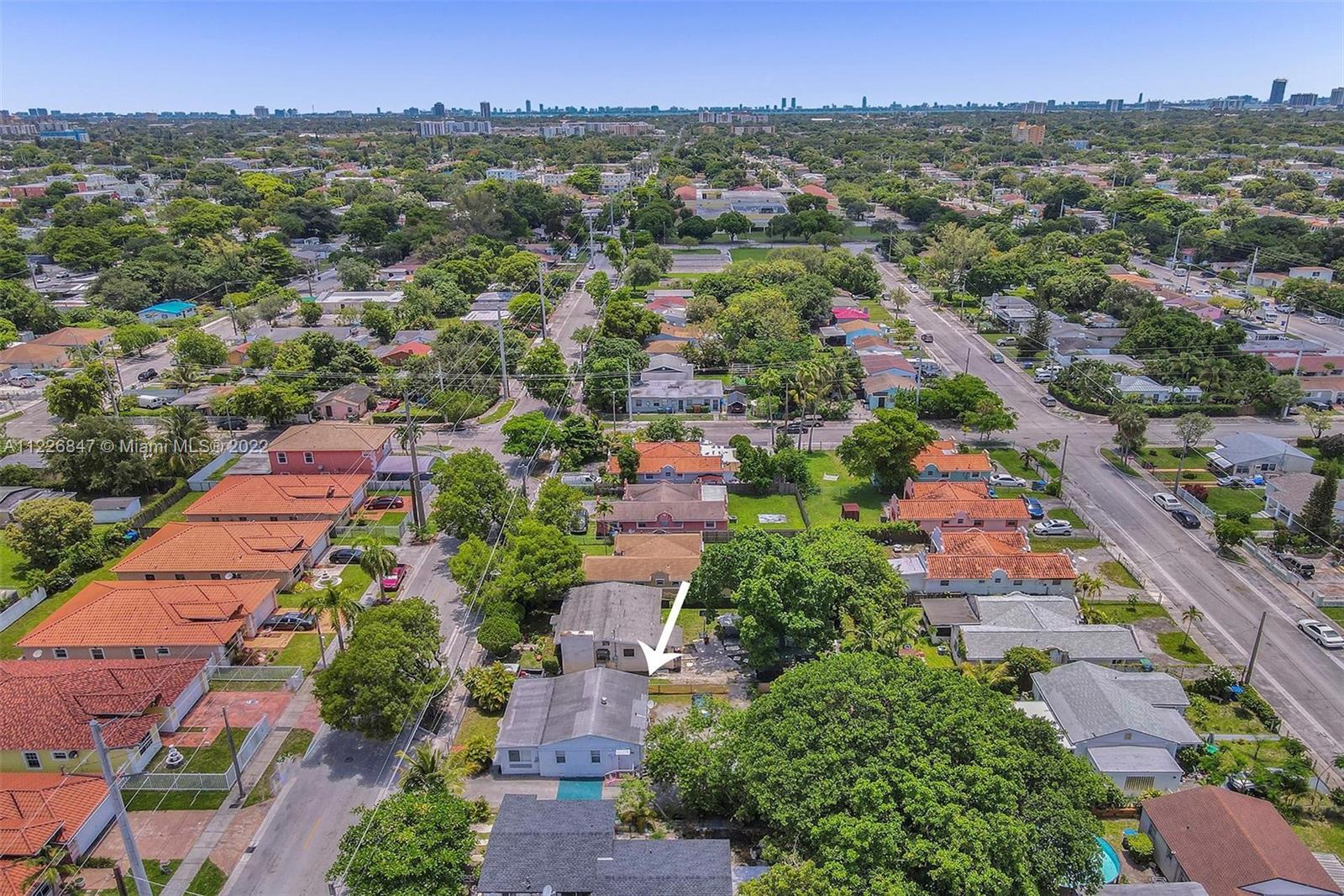 1554 Northwest 58th Street Miami, FL 33142 - Photo 54 of 57 an aerial view of residential houses with outdoor space