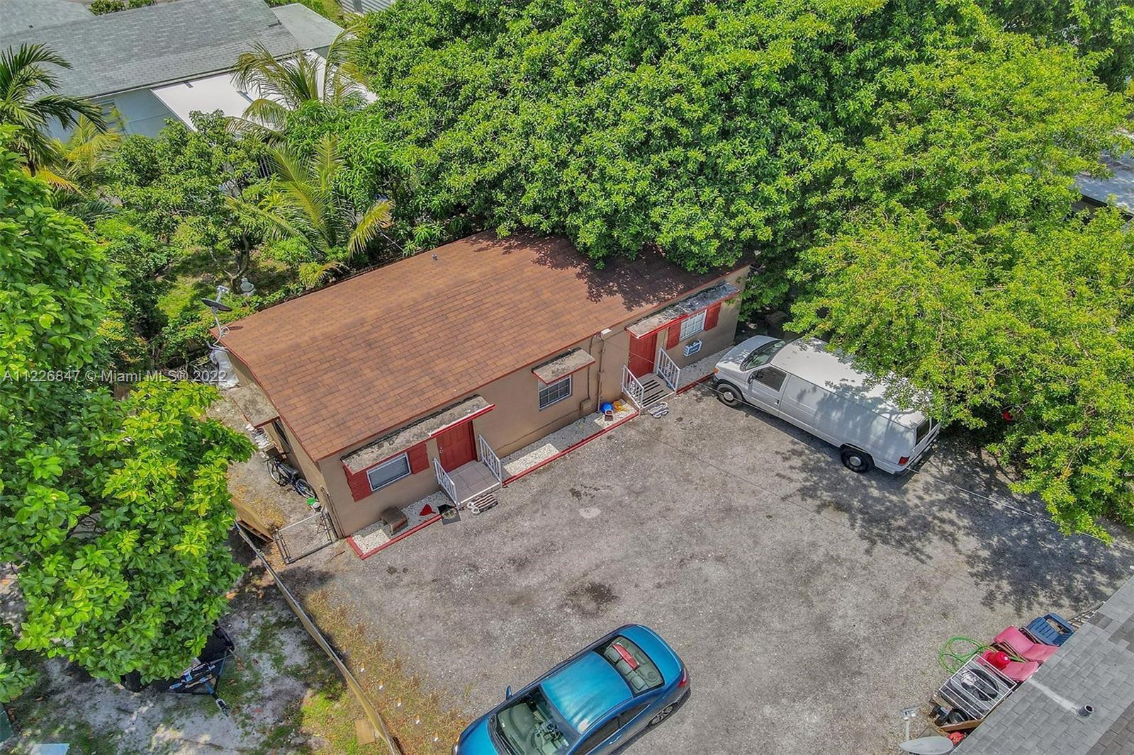 1554 Northwest 58th Street Miami, FL 33142 - Photo 56 of 57 an aerial view of a house with a yard
