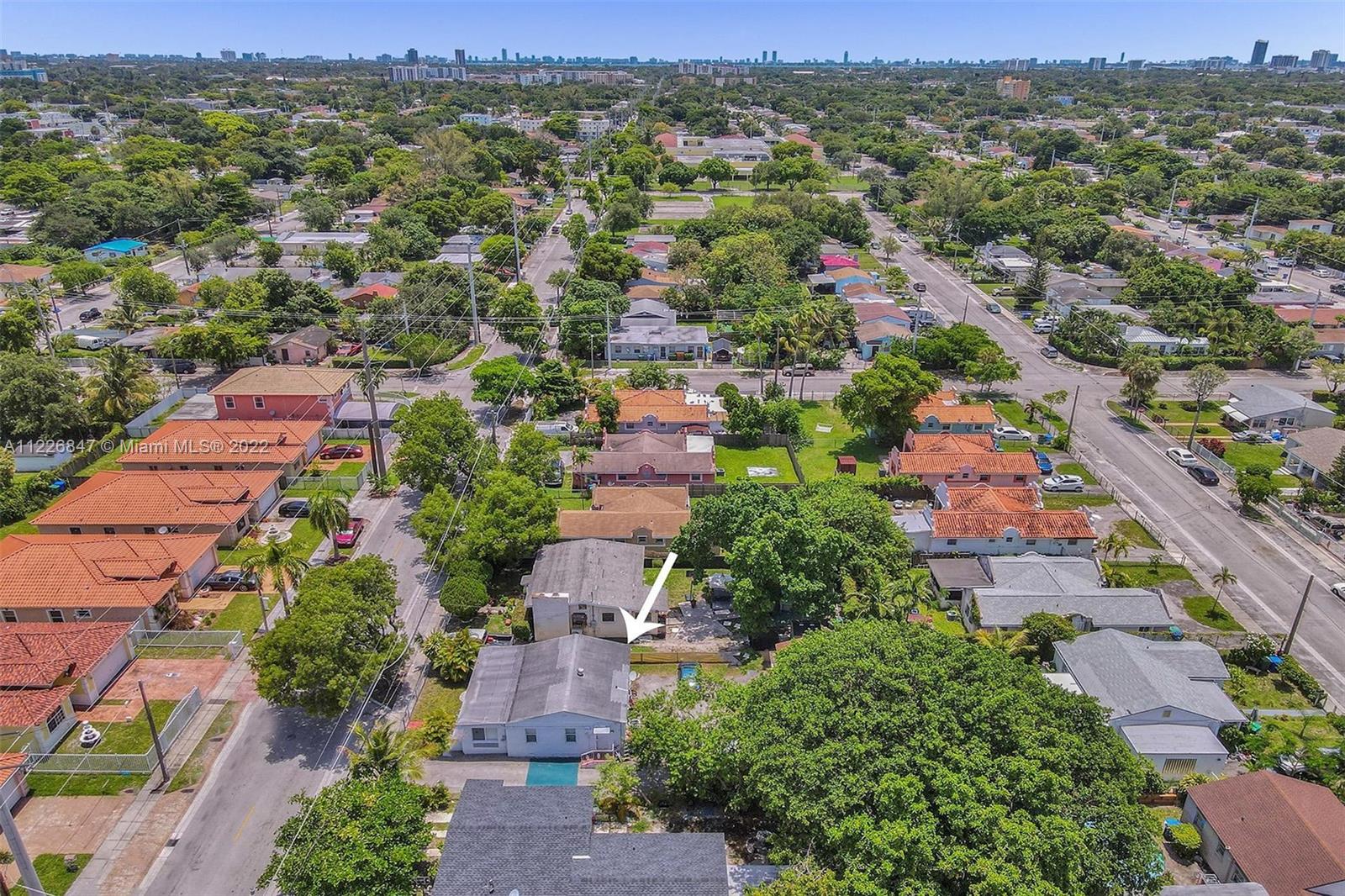 1554 Northwest 58th Street Miami, FL 33142 - Photo 57 of 57 an aerial view of residential houses with outdoor space and parking space