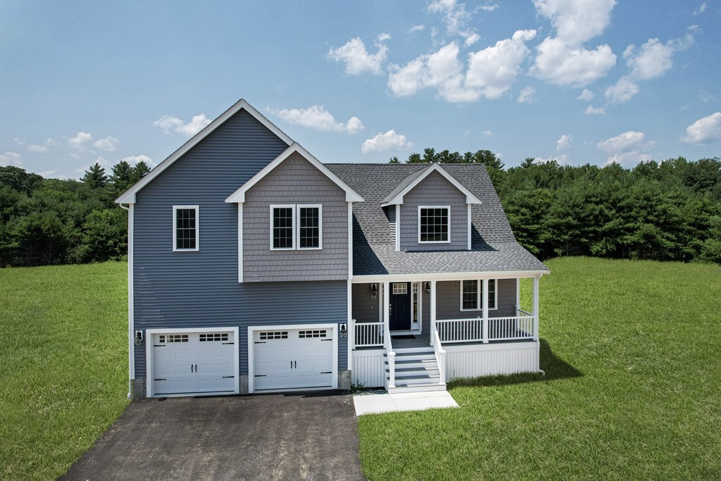 5 May Road Millis, MA 02054 - Photo 2 of 10 a view of a house with a yard and a garden