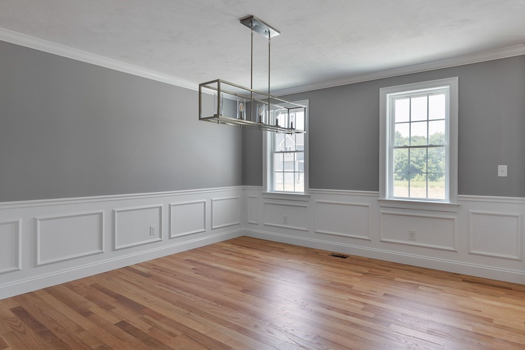 5 May Road Millis, MA 02054 - Photo 7 of 10 a view of empty room with wooden floor and fan