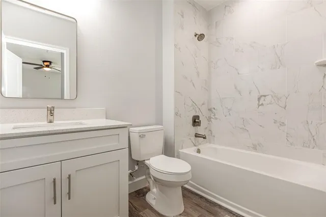 a bathroom with a sink a toilet and a bathtub