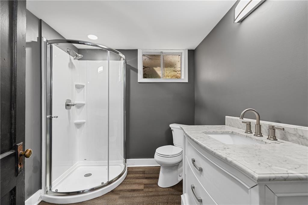 570 Steiner Bridge Road Valencia, PA 16059 - Photo 11 of 35 a bathroom with a granite countertop sink toilet and shower
