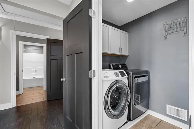 a bathroom with a granite countertop sink vanity and mirror