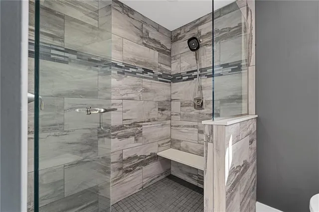 a spacious bathroom with a bathtub sink and toilet