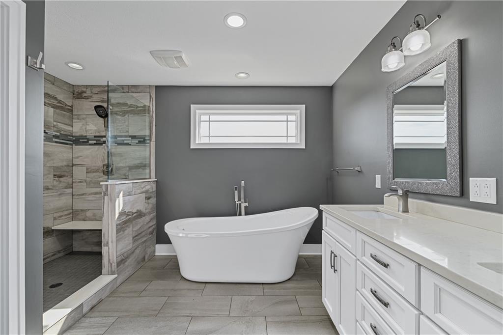 570 Steiner Bridge Road Valencia, PA 16059 - Photo 17 of 35 a spacious bathroom with a bathtub sink and toilet