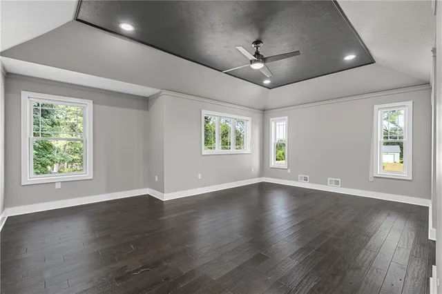 a living room with a fireplace and a mirror