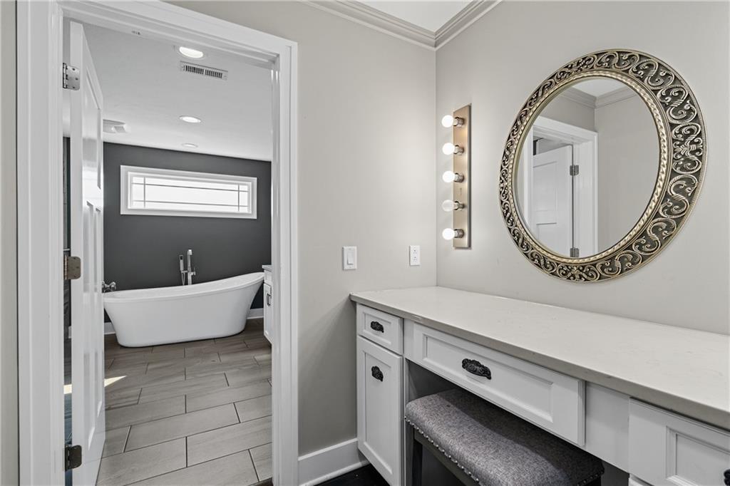 570 Steiner Bridge Road Valencia, PA 16059 - Photo 19 of 35 a living room with a fireplace and a mirror