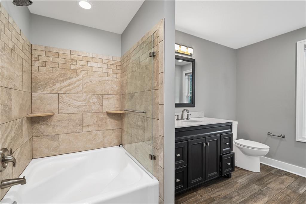 570 Steiner Bridge Road Valencia, PA 16059 - Photo 20 of 35 a bathroom with a sink a toilet and shower