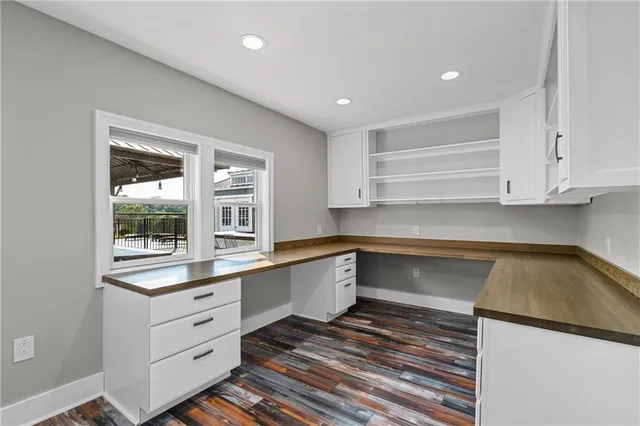 a kitchen with a refrigerator and window