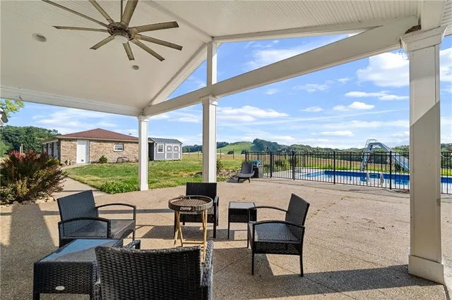 a view of balcony with wooden floor and outdoor seating