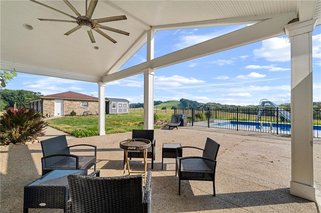 570 Steiner Bridge Road Valencia, PA 16059 - Photo 25 of 35 a living room with furniture and a floor to ceiling window