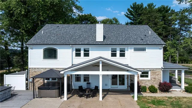 a front view of house with yard and outdoor seating