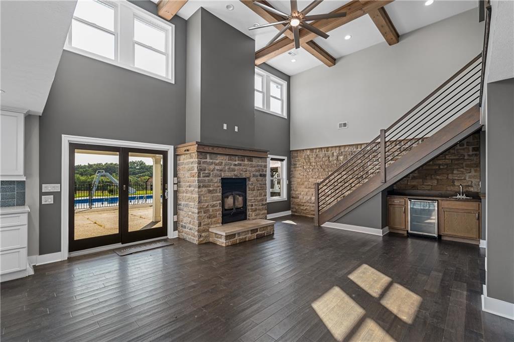 570 Steiner Bridge Road Valencia, PA 16059 - Photo 4 of 35 a view of a livingroom with fireplace wooden floor and windows