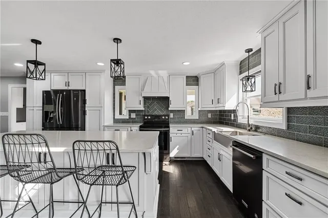 a kitchen with stainless steel appliances cabinets a microwave and a counter top space