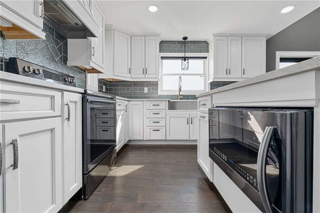570 Steiner Bridge Road Valencia, PA 16059 - Photo 8 of 35 a kitchen with stainless steel appliances cabinets a microwave and a counter top space