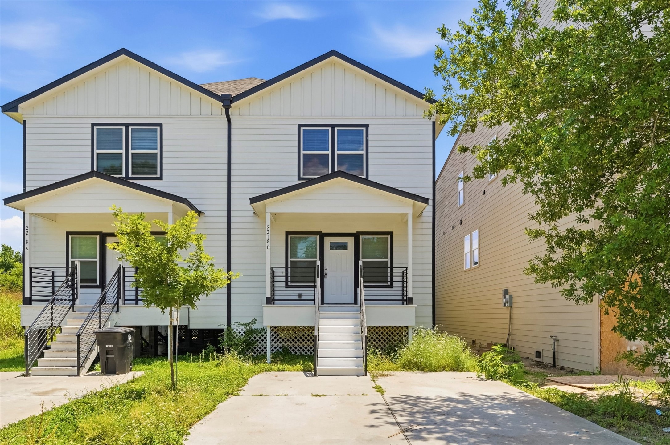 2218 Bringhurst Street, Unit B Houston, TX 77026 - Photo 1 of 25 a front view of a house with garden