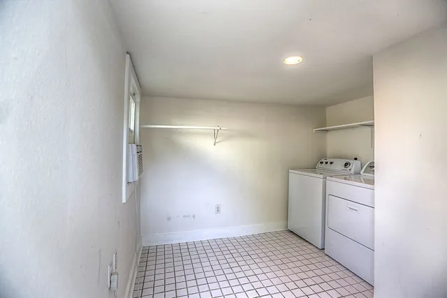 a room with a stove and a refrigerator