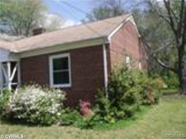 3633 Plainfield Road Richmond, VA 23234 - Photo 2 of 5 a front view of a house with a yard