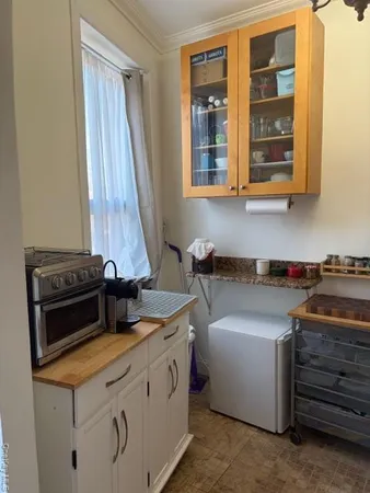 a kitchen with a stove and a sink