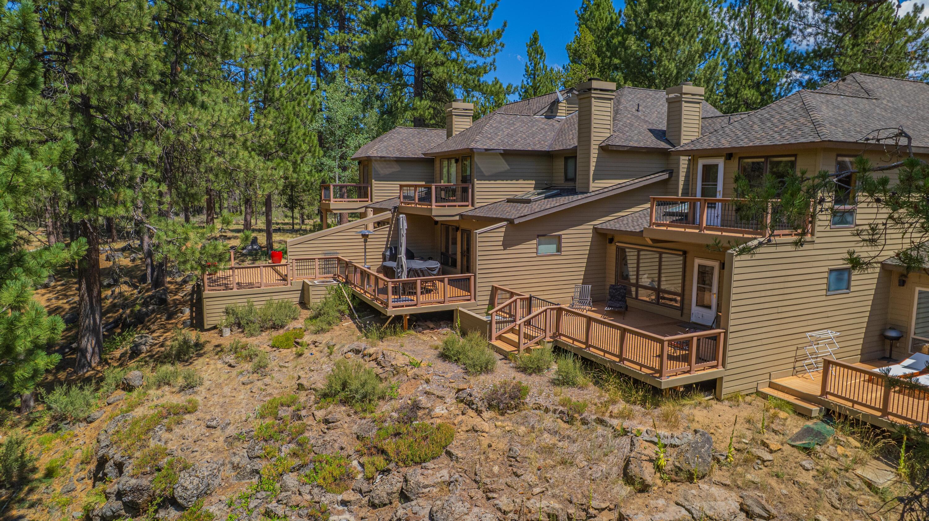 17674 Bittern Lane, Unit 7 Sunriver, OR 97707 - Photo 37 of 43 Deck-level perspective looking across the Deschutes River greenbelt, framed by mature pines and open lawn.
