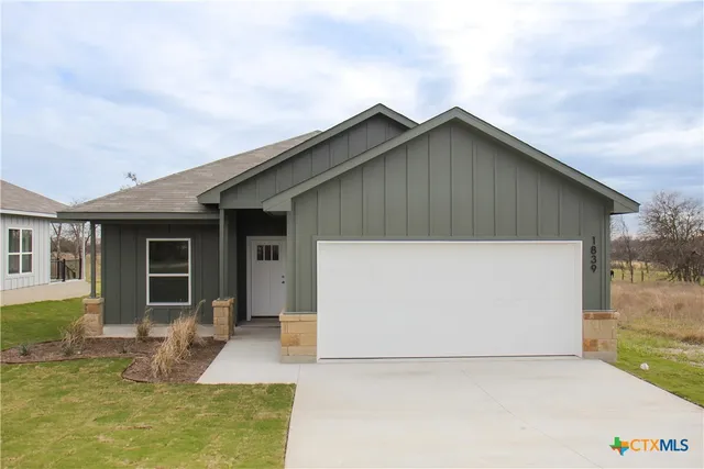 a front view of house with yard