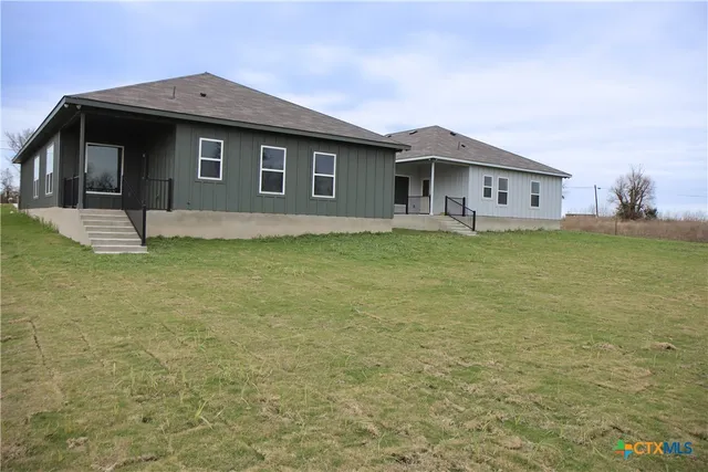a house view with a garden space