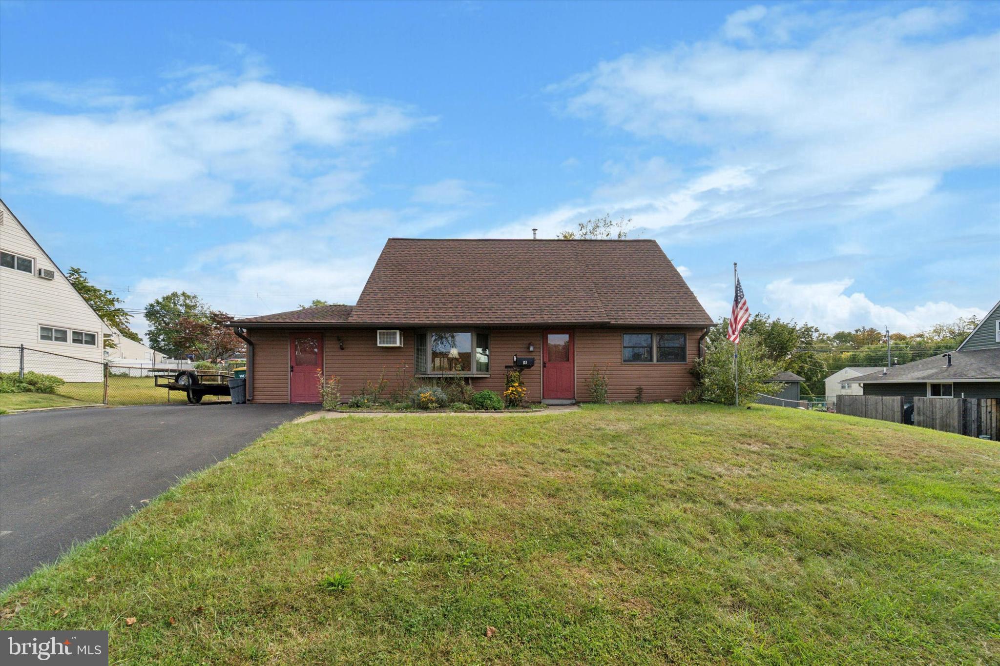 14 Cinnamon Road Levittown, PA 19057 - Photo 1 of 15 a backyard of a house with table and chairs
