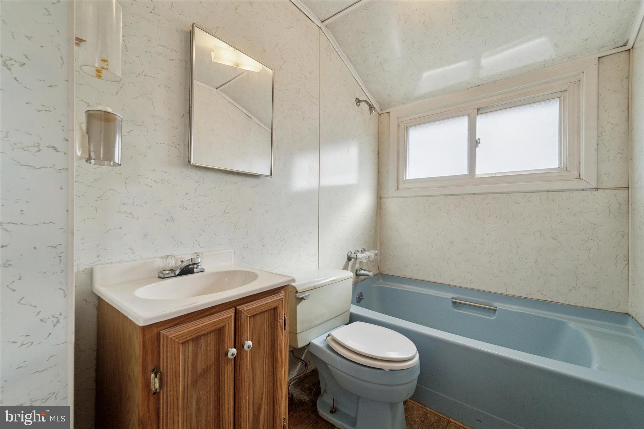 14 Cinnamon Road Levittown, PA 19057 - Photo 11 of 15 a bathroom with a sink a toilet and a bathtub
