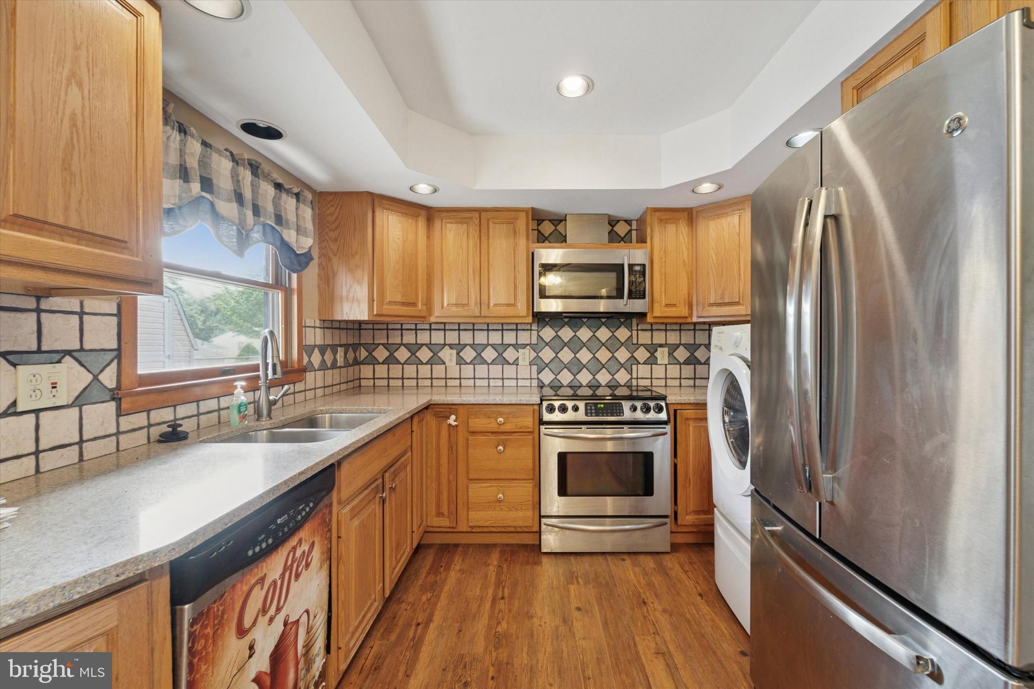 14 Cinnamon Road Levittown, PA 19057 - Photo 5 of 15 a kitchen with a sink stove and refrigerator