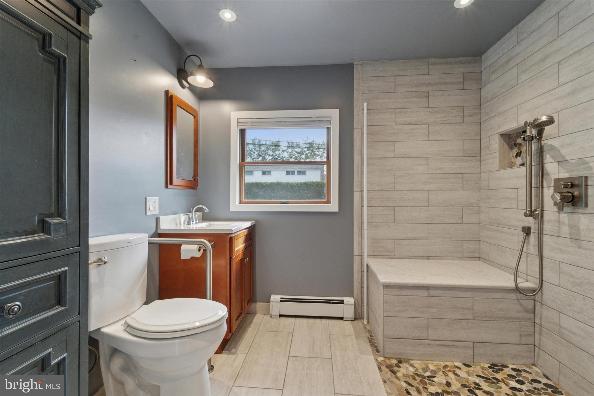 14 Cinnamon Road Levittown, PA 19057 - Photo 6 of 15 a bathroom with a toilet a sink and bathtub