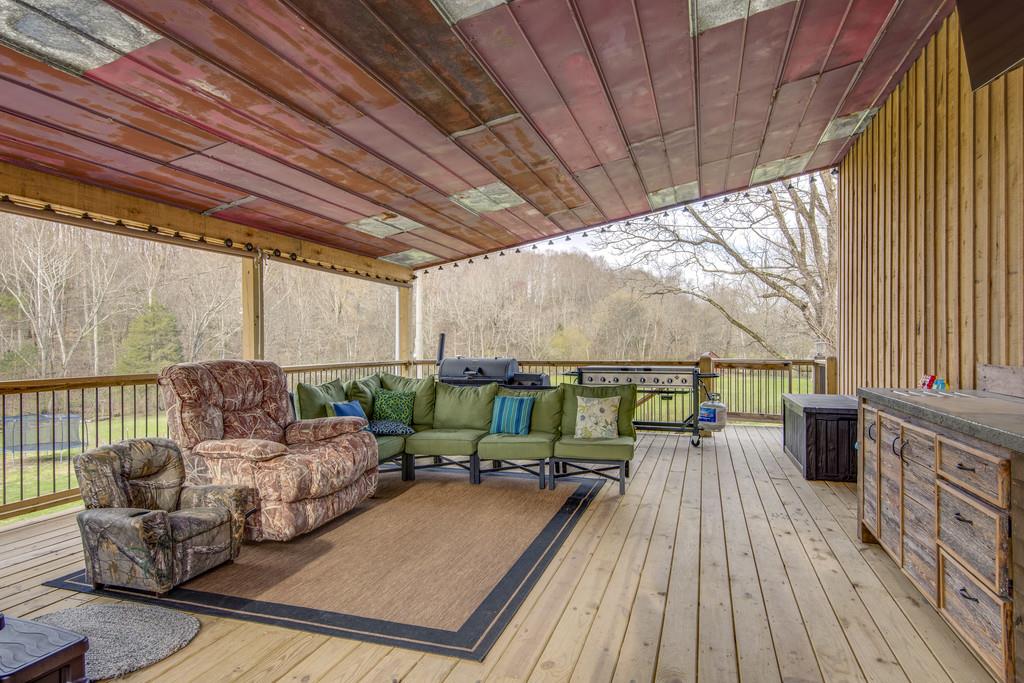 545 Haley Road Burns, TN 37029 - Photo 23 of 30 a balcony with furniture and a wooden floor