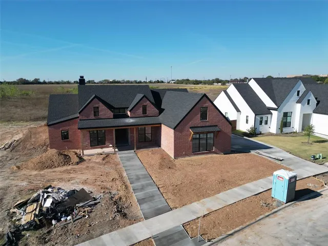 a front view of a house with yard