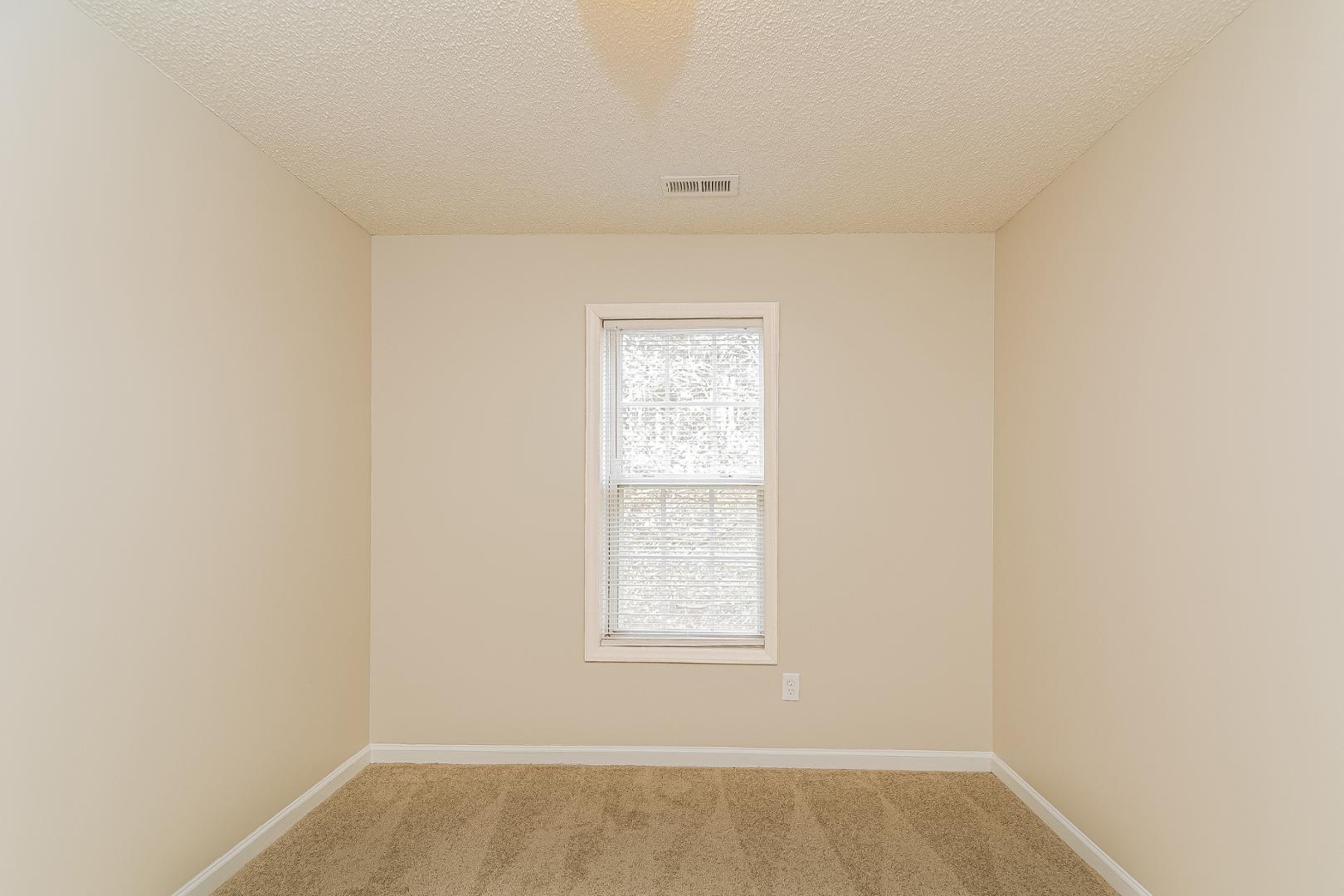 2100 McKinnon Drive Clayton, NC 27520 - Photo 13 of 17 an empty room with a window