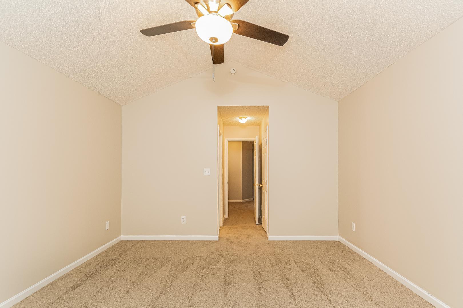 2100 McKinnon Drive Clayton, NC 27520 - Photo 8 of 17 an empty room with a fan and a fan