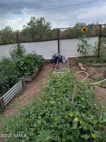 a view of a water pond with sitting area