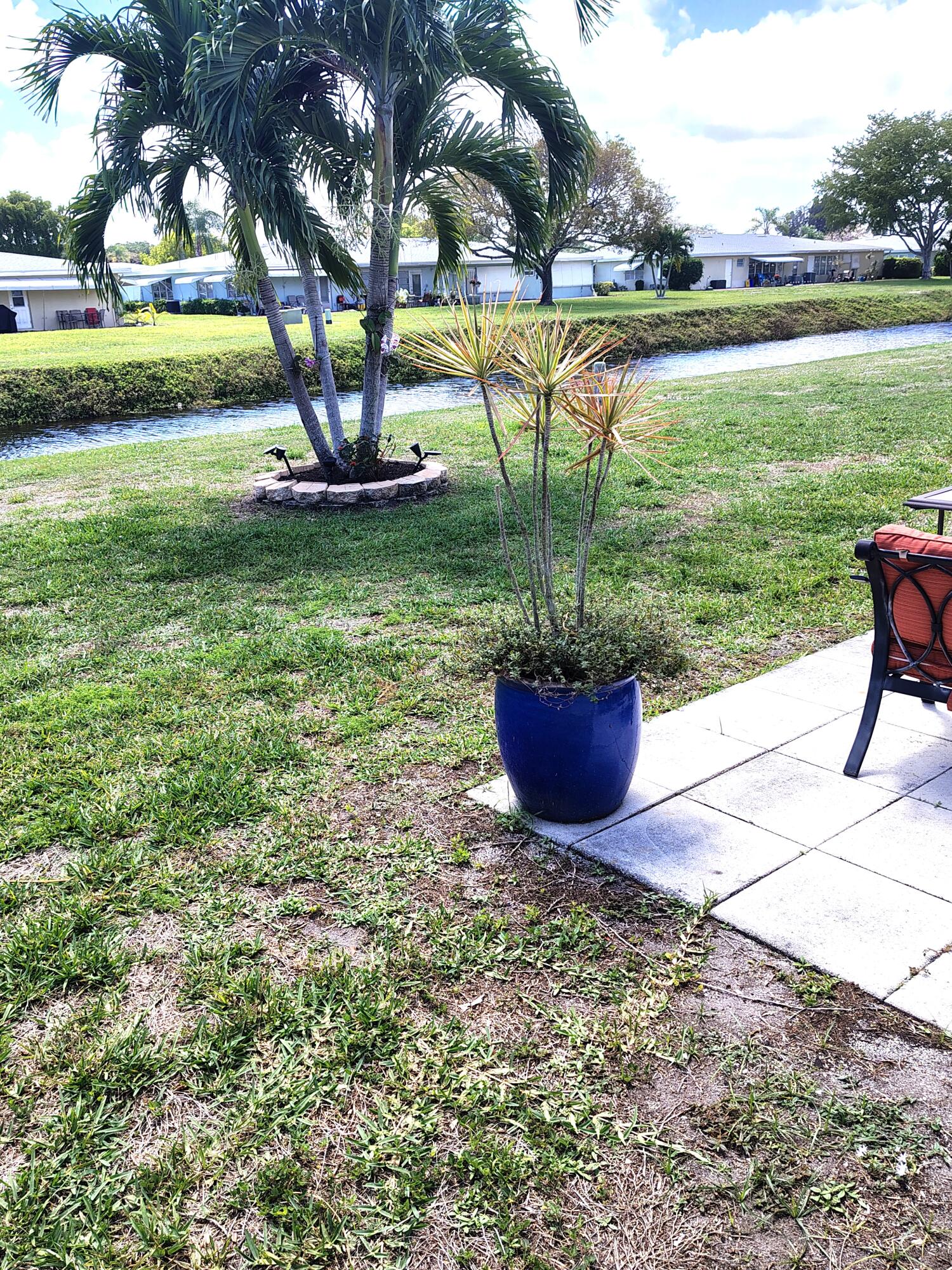 380 High Point Boulevard, Unit A Delray Beach, FL 33445 - Photo 14 of 18 a view of a garden with an ocean view