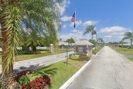 380 High Point Boulevard, Unit A Delray Beach, FL 33445 - Photo 17 of 18 a view of a garden with a house