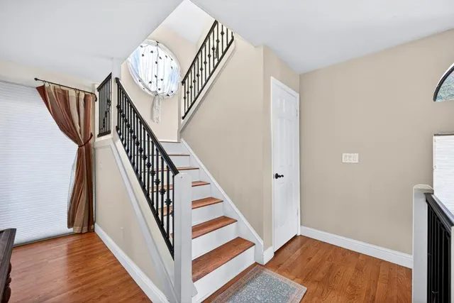 a bathroom with a sink toilet and a mirror
