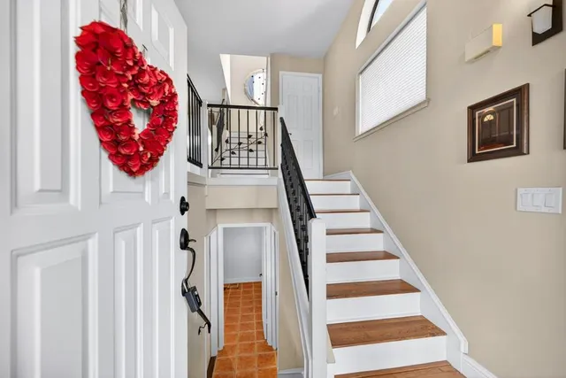 a living room with furniture and a book shelf