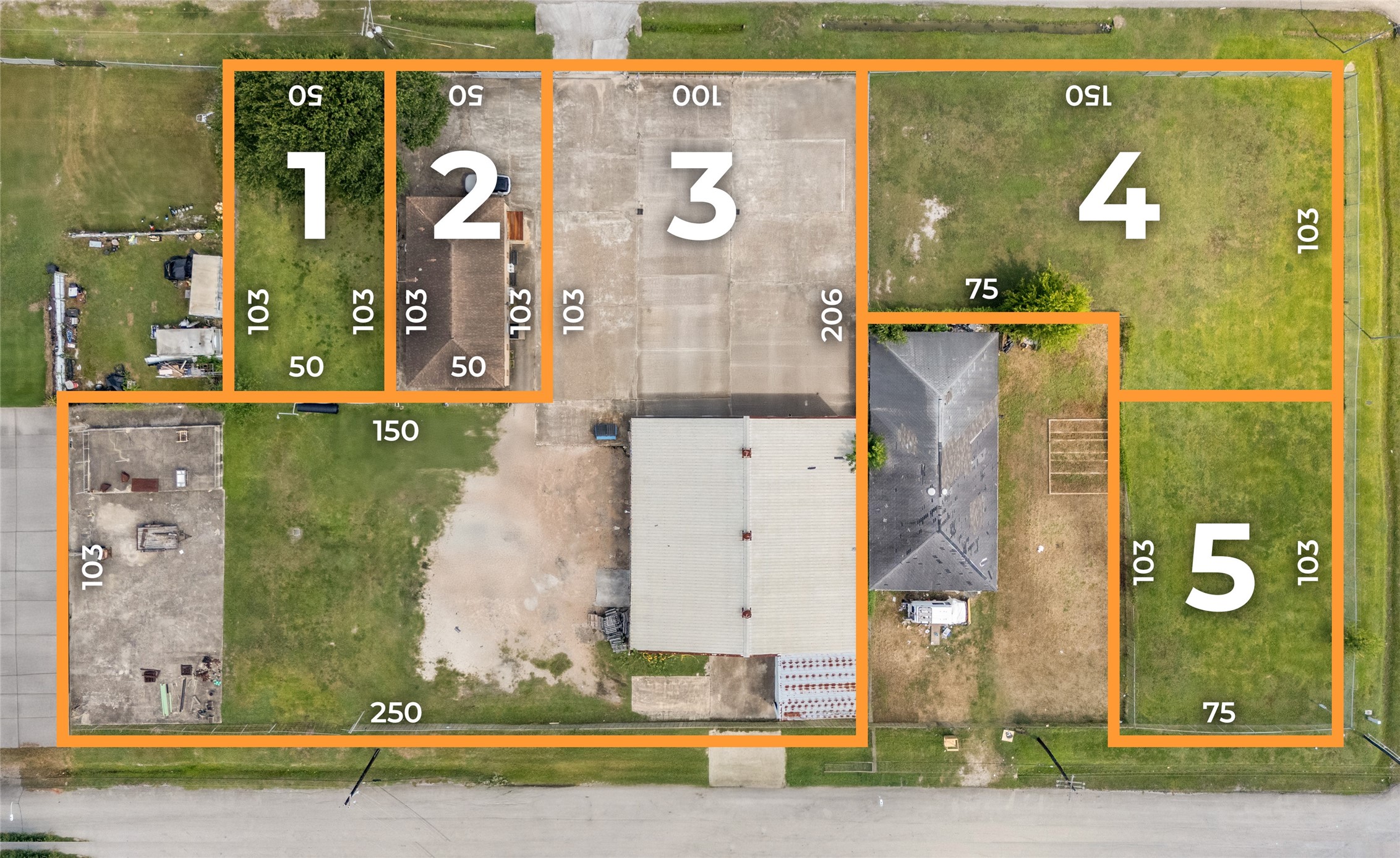 an aerial view of a residential building with outdoor space and parking