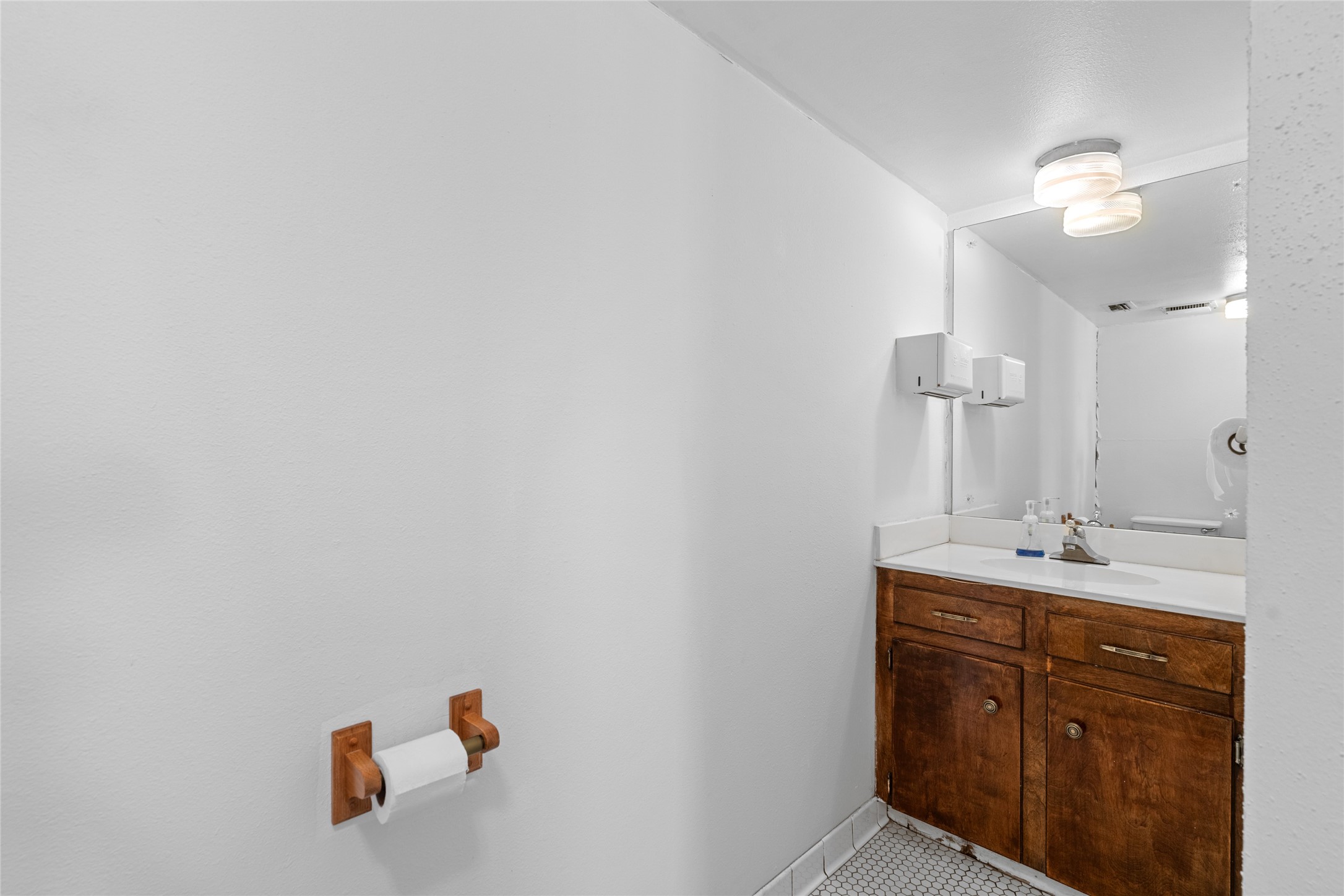 6910 Winton Street Houston, TX 77021 - Photo 15 of 50 a bathroom with a sink and a mirror