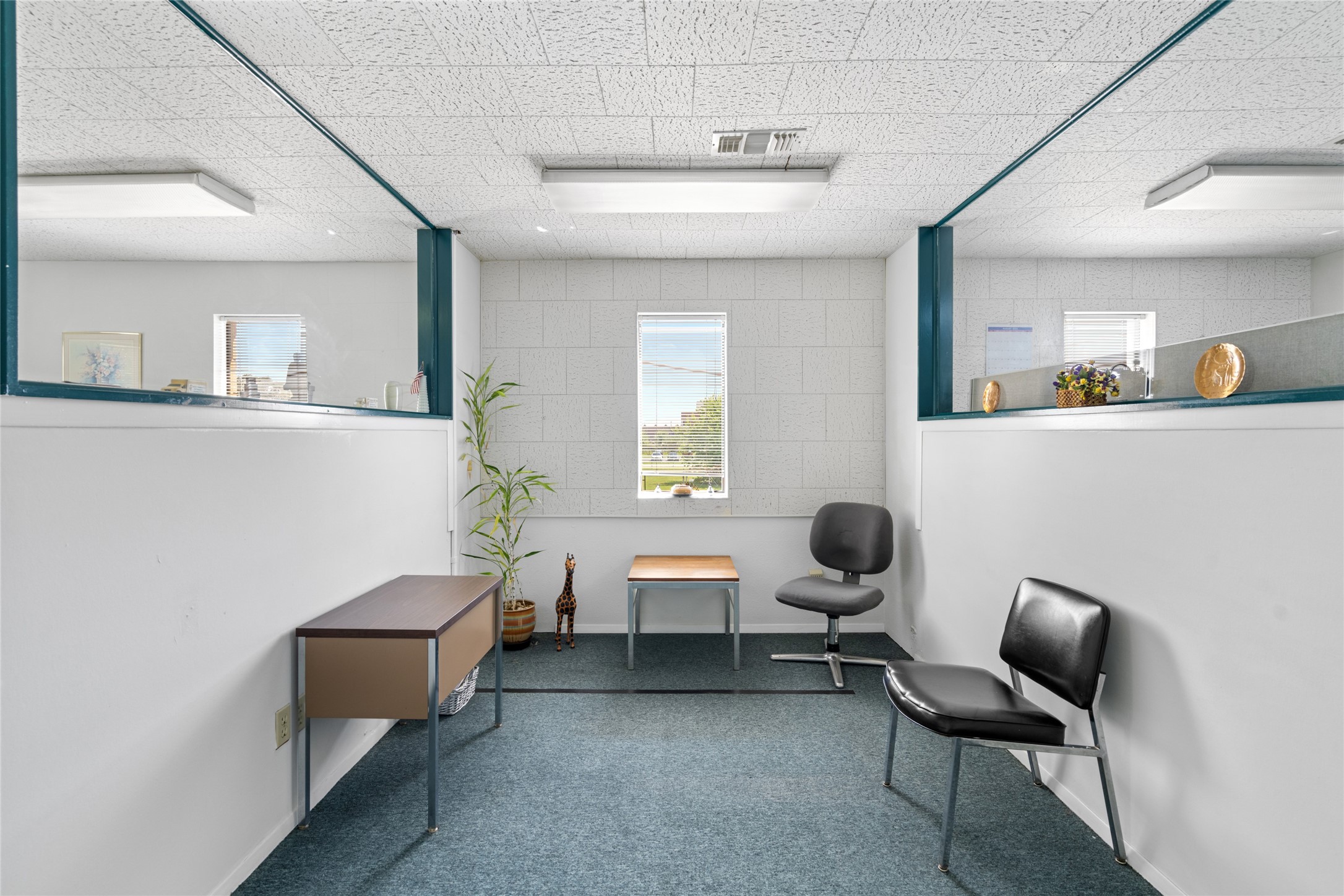 6910 Winton Street Houston, TX 77021 - Photo 29 of 50 a room with a chair and wooden floor