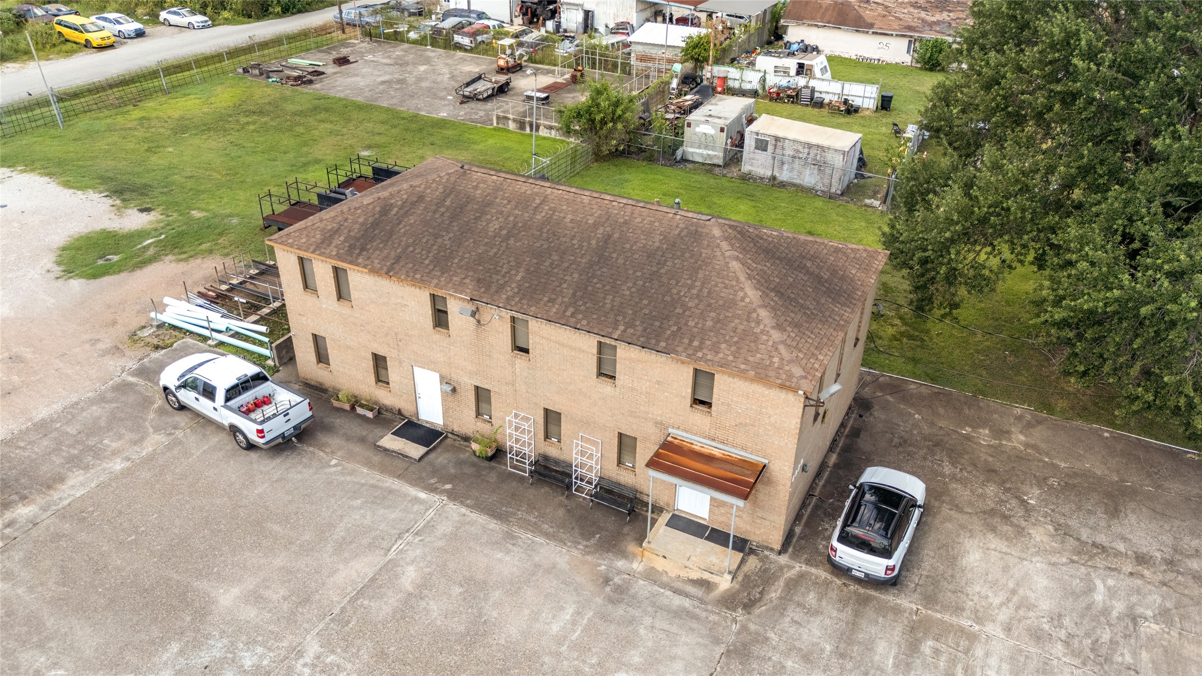 6910 Winton Street Houston, TX 77021 - Photo 42 of 50 an aerial view of a house with garden space and parking