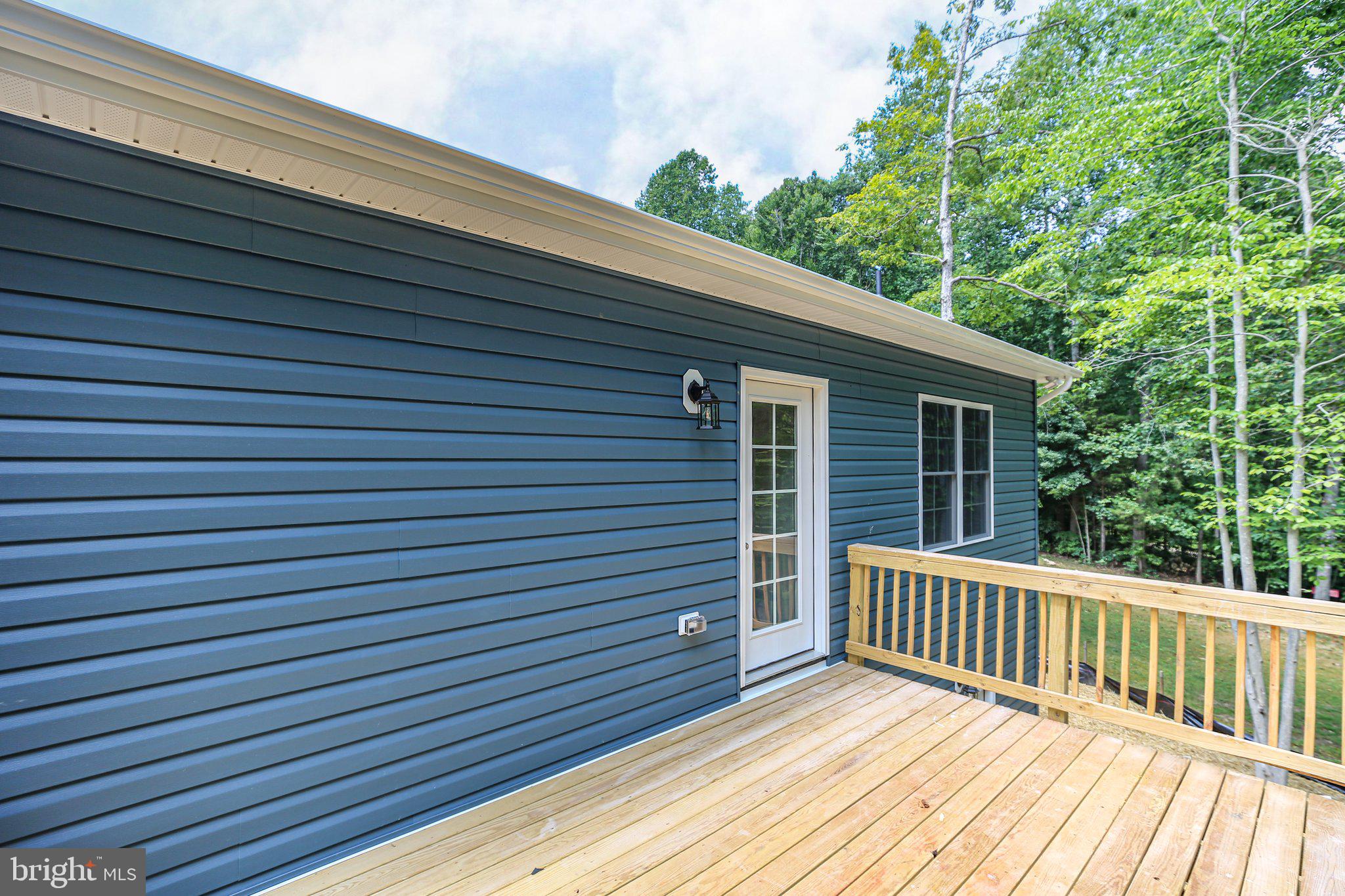 14 Johnson Drive Ruther Glen, VA 22546 - Photo 30 of 40 Deck just steps away from the kitchen