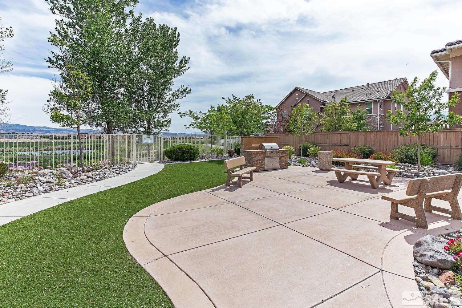 1924 Wind Ranch Road, Unit B Reno, NV 89521 - Photo 18 of 18 a view of a backyard with sitting area