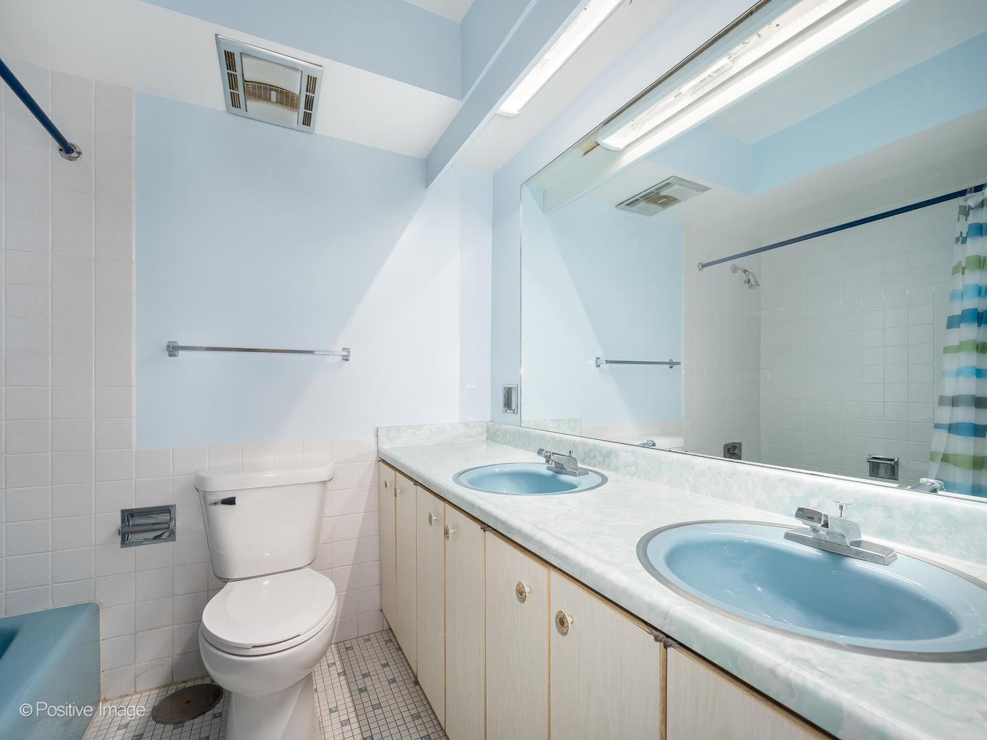 4710 Russett Lane, Unit R1 Skokie, IL 60076 - Photo 11 of 16 a bathroom with a granite countertop toilet a sink and a mirror